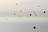 IN FLIGHT - APRIL 07: Hot air balloons which departed from Lydden Hill race circuit near Canterbury take part in a mass crossing of the Channel on April 7, 2011 in flight over the English Channel. 51 balloonists of various nationalities from across Europe took off from Kent making for Calais, France at about 7am. It is the first time a Guinness World Record bid has been made for "the largest group of hot air balloons to make the Channel crossing". (Photo by Oli Scarff/Getty Images)