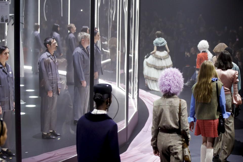 Models wear creations as part of Gucci's Fall/Winter 2020/2021 collection, presented in Milan, Italy, Wednesday, Feb. 19, 2020. (AP Photo/Luca Bruno)