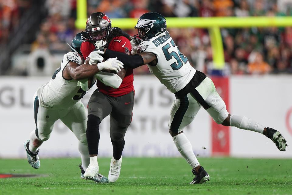 Jan 15, 2024; Tampa, Florida, USA; Tampa Bay Buccaneers running back Rachaad White (1) is tackled by Philadelphia Eagles linebacker Zach Cunningham (52) during the first half of a 2024 NFC wild card game at Raymond James Stadium. Mandatory Credit: Nathan Ray Seebeck-USA TODAY Sports