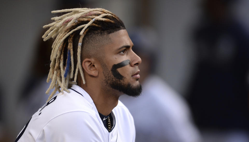 FILE - In this Aug. 10, 2019, file photo, San Diego Padres' Fernando Tatis Jr. looks on from the dugout during the fifth inning of the baseball game against the Colorado Rockies, in San Diego. Padres rookie shortstop Fernando Tatis Jr. has become one of major league baseball’s most exciting young players, showing an instinct and aggressiveness that make it hard to believe he’s only 20. (AP Photo/Orlando Ramirez, File)