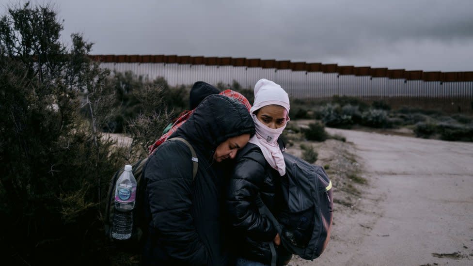 Migrants wait to be transported for asylum claim processing at the US-Mexico border in Campo, California, US, on Friday, April 5, 2024