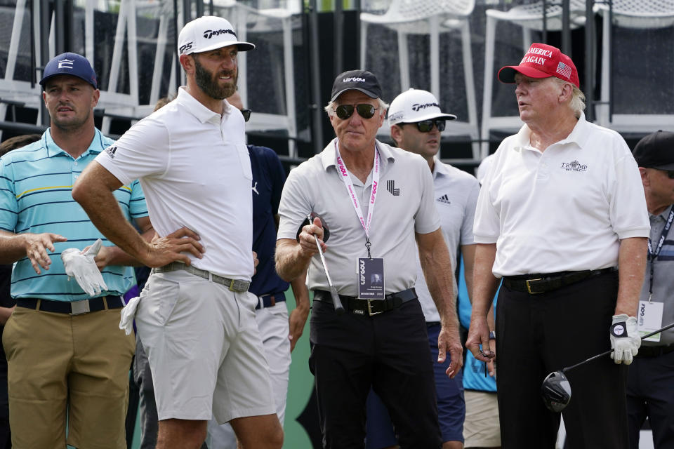 Golfers Bryson DeChambeau, Dustin Johnson, LIV Golf CEO Greg Norman and former President Donald Trump, left to right, look on during the pro-am round of the Bedminster Invitational LIV Golf tournament in Bedminster, NJ., Thursday, July 28, 2022. (AP Photo/Seth Wenig)