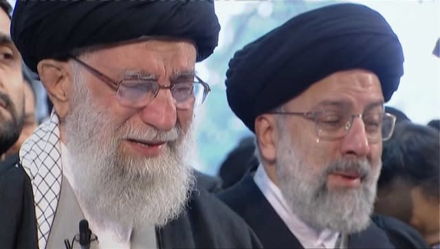 Iranian Supreme Leader Ayatollah Ali Khamenei, left, weeps as he leads a prayer over the coffin of General Qassem Soleimani 