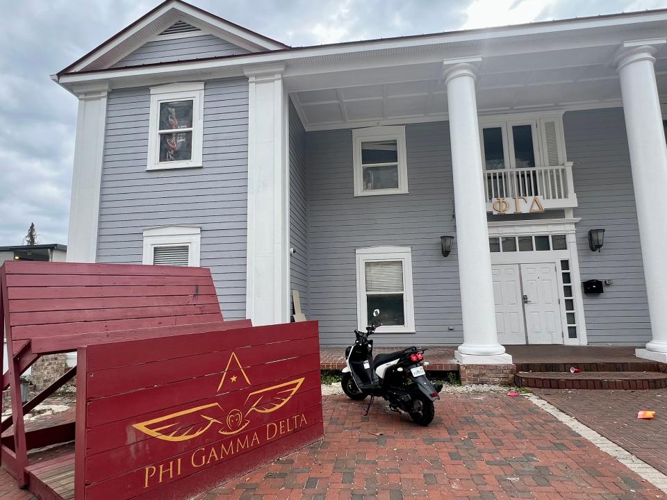 The exterior of the Phi Gamma Delta (FIJI) fraternity house on W College Ave.