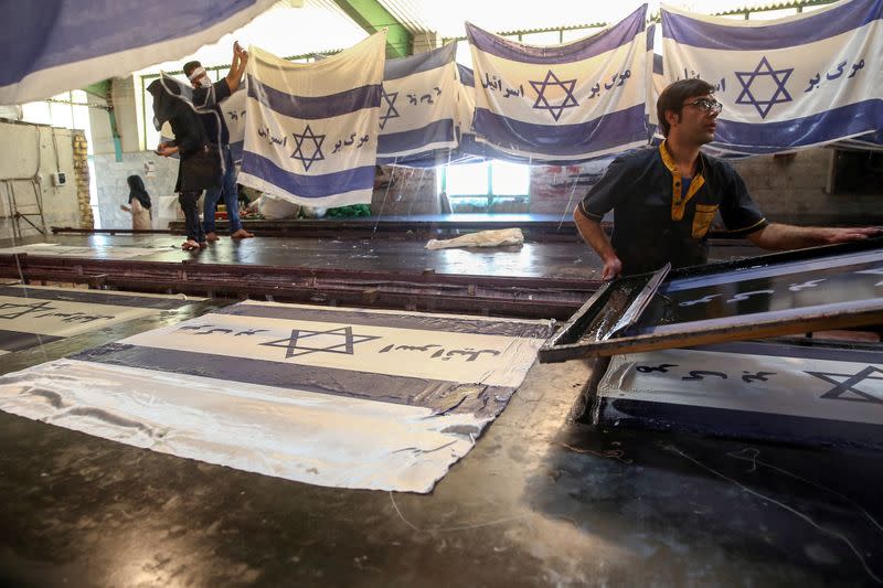 Large flag factory creates U.S. and Israeli flags for Iranian protesters to burn in Khomein City