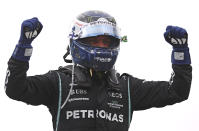 Mercedes' Veltteri Bottas celebrates winning the Sprint Race qualifying session at the Interlagos racetrack, in Sao Paulo, Brazil, Saturday, Nov.13, 2021. The Brazilian Formula One Grand Prix will take place on Sunday. (Lars Baron/Pool via AP)