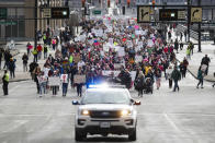 <p>Protestors participate in a Women’s March highlighting demands for equal rights and equality for women, Saturday, Jan. 20, 2018, in Cincinnati. Ohio. (Photo: John Minchillo/AP) </p>