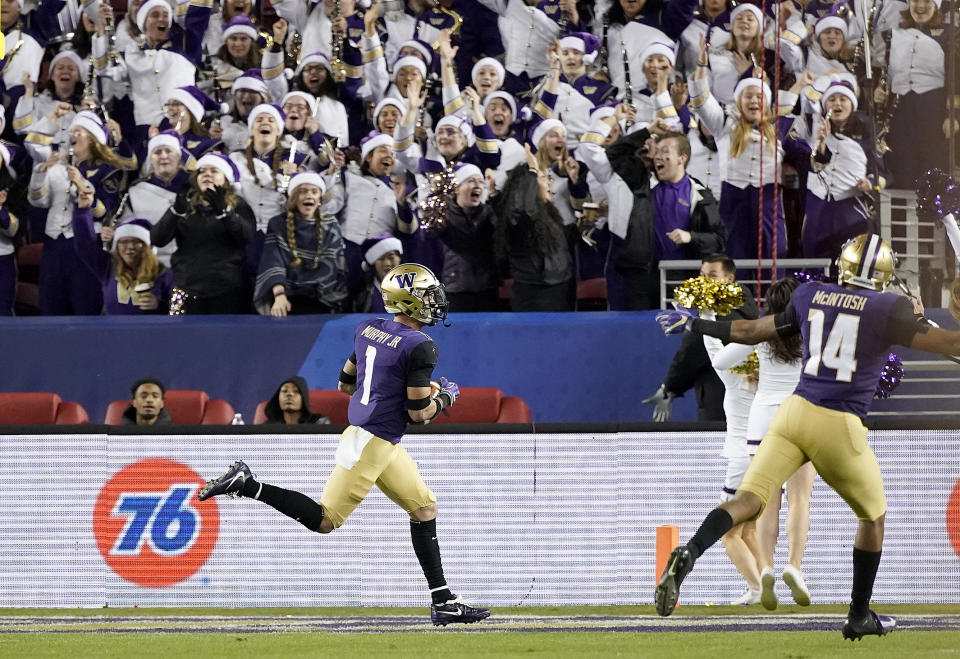 Washington defensive back Byron Murphy (1) returns an interception for a touchdown against Utah during the second half of the Pac-12 Conference championship NCAA college football game in Santa Clara, Calif., Friday, Nov. 30, 2018. (AP Photo/Tony Avelar)