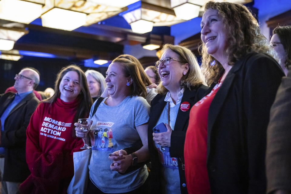 Supporters of Former U.S. Rep. Tom Suozzi, Democratic candidate for New York's 3rd congressional district, cheer while watching live updates at his election night party Tuesday, Feb. 13, 2024, in Woodbury, N.Y. (AP Photo/Stefan Jeremiah)