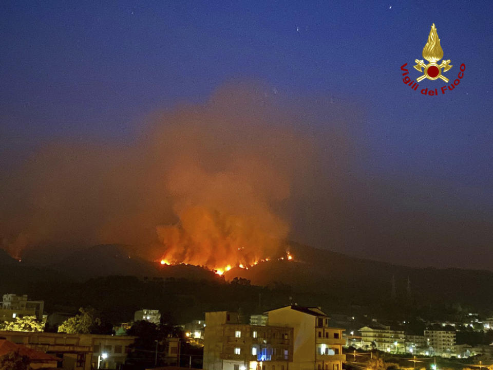 This picture released by the Italian firefighters shows wildfires in the region of Palermo in Sicily, Italy, Tuesday July 25, 2023. (Italian Firefighters - Vigili del Fuoco via AP)