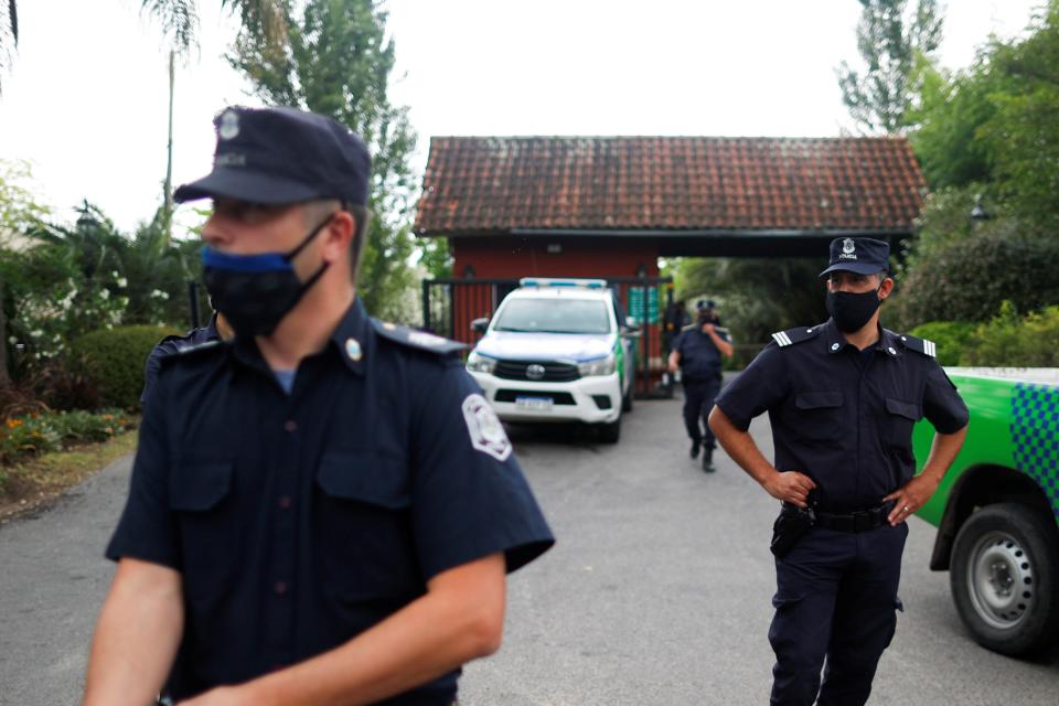 Police guard the home where Diego Maradona’s body was retrieved fromReuters