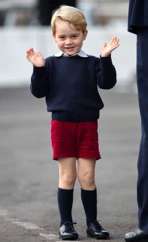 Pool/Sam Hussein/WireImage Prince George gives a wave as he leaves Canada with his family in 2016.