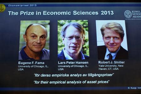 Photos of the 2013 Nobel Prize laureates in Economic Sciences Eugene Fama (L-R), Lars Peter Hansen and Robert Shiller are displayed during a news conference at the Royal Swedish Academy of Sciences in Stockholm October 14, 2013. REUTERS/Claudio Bresciani/TT News Agency