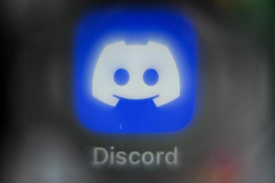 An illustration picture taken on March 2, 2023 in Moscow shows a smart phone screen bearing the Discord social network application logo.