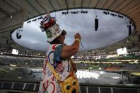 <p>Vivianne Robinson takes photos before the start of the closing ceremony for the Summer Olympics in Rio de Janeiro, Brazil, Sunday, Aug. 21, 2016. (AP Photo/Mark Humphrey) </p>