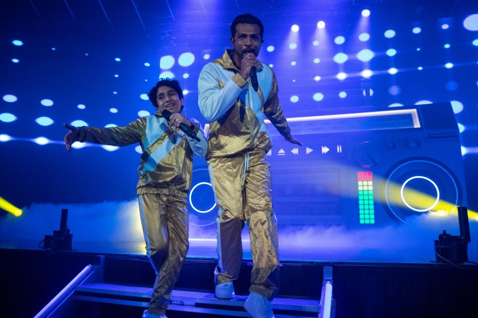 The family musical comedy "World's Best" centers on a 12-year-old math genius (Manny Magnus, left) who becomes empowered by the rap-fueled fantasies he has performing with his late dad, a famous rapper (Utkarsh Ambudkar).