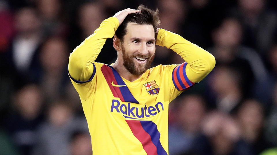 Lionel Messi with his hands on his head looking frustrated against Real Betis.