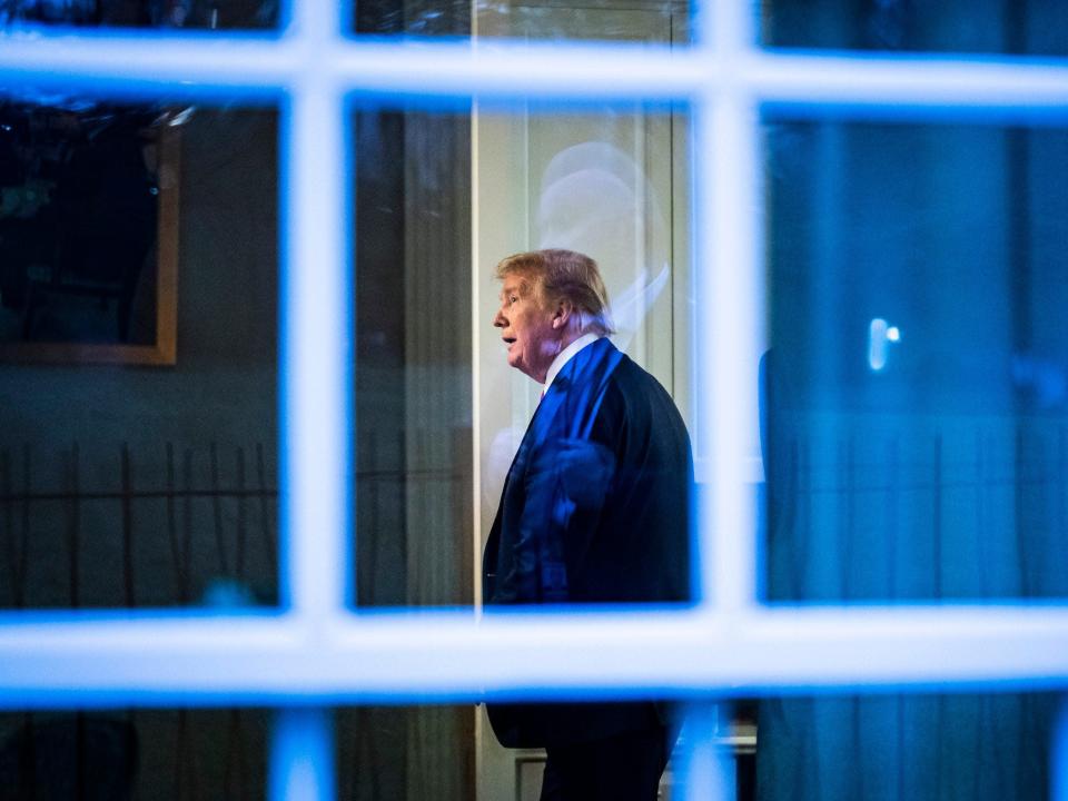 Donald J. Trump, seen through a window, watches a television in the press office as newscasters talk about him moments after he was speaking with members of the coronavirus task force during a briefing in response to the COVID-19 coronavirus pandemic in the James S. Brady Press Briefing Room at the White House on Wednesday, April 22, 2020 in Washington, DC. (