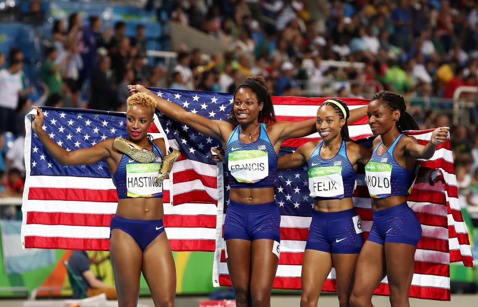 <p>(L-R) Natasha Hastings, Phyllis Francis, Allyson Felix and Courtney Okolo of the United States react after winning gold in the Women’s 4 x 400 meter Relay on Day 15 of the Rio 2016 Olympic Games at the Olympic Stadium on August 20, 2016 in Rio de Janeiro, Brazil. (Photo by Cameron Spencer/Getty Images) </p>