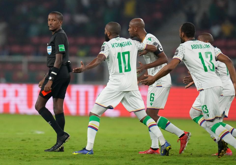 Referee Bamlak Tessema (left) prepares to show a red card to Comoros captain Jimmy Abdou (centre) at the Africa Cup of Nations round of 16 tie (Themba Hadebe/AP) (AP)