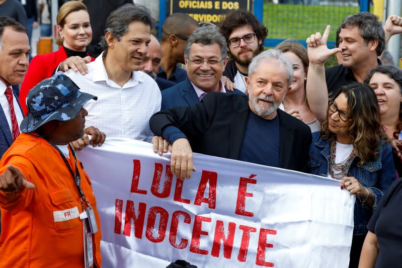 Former Brazilian President Luiz Inacio Lula da Silva walks out after being released from prison, in Curitiba