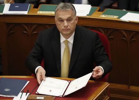 Hungarian Prime Minister Viktor Orban reacts after taking the oath of office in the Parliament in Budapest, Hungary, May 10, 2018. REUTERS/Bernadett Szabo