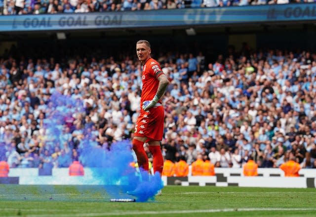 Aston Villa goalkeeper Robin Olsen stands dejected after conceding a third goal