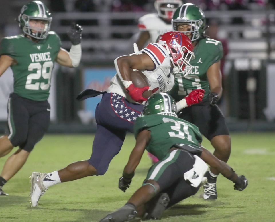 Manatee's Kei-Shawn Smith (1) works his way upfield against Venice Friday night in Venice, Florida. The Indians defeated the Hurricanes 56-24. MATT HOUSTON/HERALD-TRIBUNE
