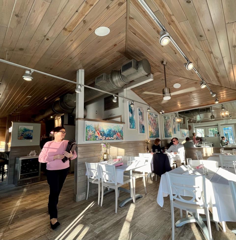 A high ceiling and mirrored wall make Sunshine Seafood Cafe's small dining room feel bigger.