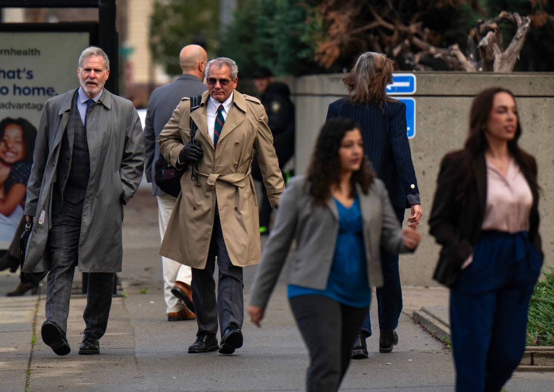 Extras are filmed leaving the Sacramento County courthouse in downtown Sacramento in a scene for a new Paul Thomas Anderson movie on Saturday.