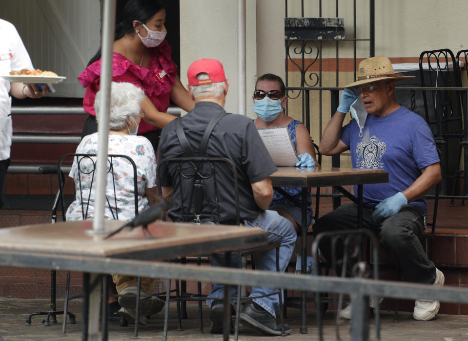 Diners at a restaurant that has reopened in San Antonio, Monday, June 15, in San Antonio. Source: AAP