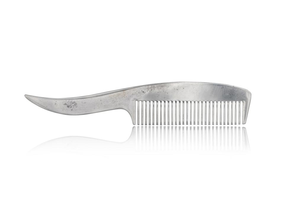 Freddie Mercury's small silver Tiffany & Co. mustache comb.