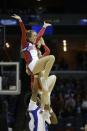 Dayton cheerleaders perform against Stanford during the first half in a regional semifinal game at the NCAA college basketball tournament, Thursday, March 27, 2014, in Memphis, Tenn. (AP Photo/Mark Humphrey)