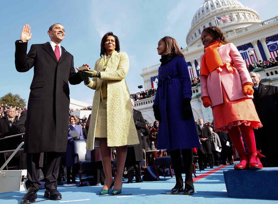 Barack Obama (L) takes the oath of office as the 44th US President with his wife, Michelle, by his side at the US Capitol in Washington, DC, January 20, 2009.