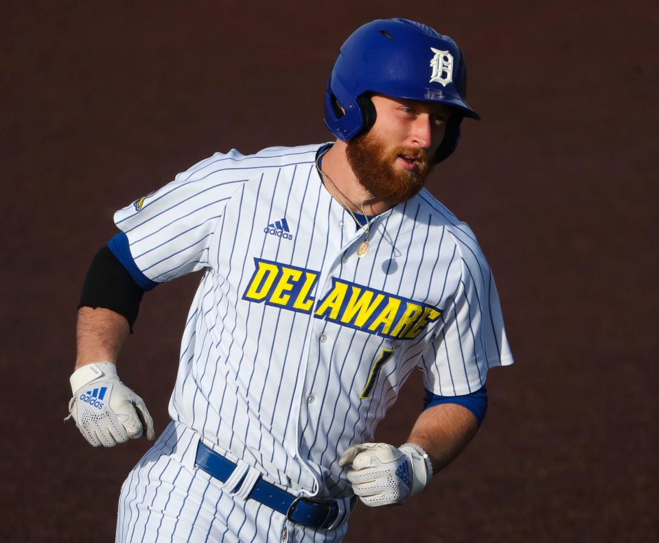 Delaware's Bryce Greenly rounds third on his home run trot after a blast in the fourth inning against Delaware State in the Blue Hens' 14-12 win Tuesday, March 21, 2023 at Bob Hannah Stadium.