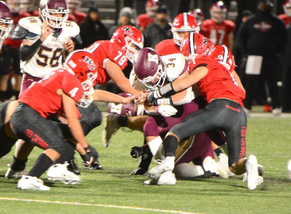 Killingly senior Soren Rief is surrounded by New Canaan defenders during the Class L quarterfinals Tuesday at Dunning Field.