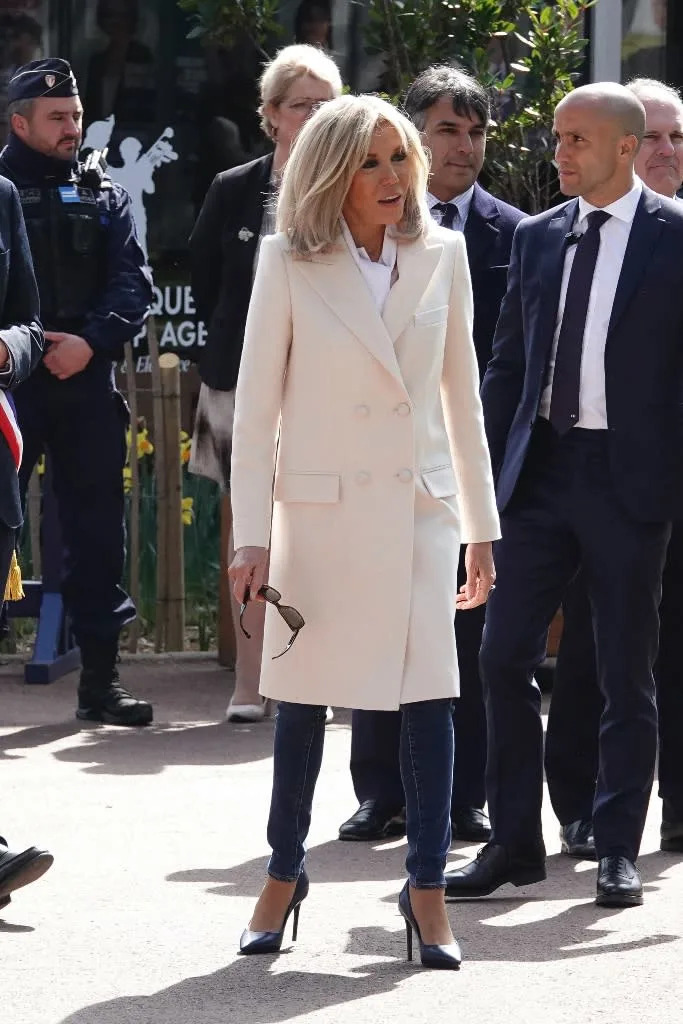 Brigitte Macron accompanies French President Emmanuel Macron to cast their ballot for the first round of France&#x002019;s presidential election at a polling station in Le Touquet, France on April 10, 2022. - Credit: Sipa USA via AP