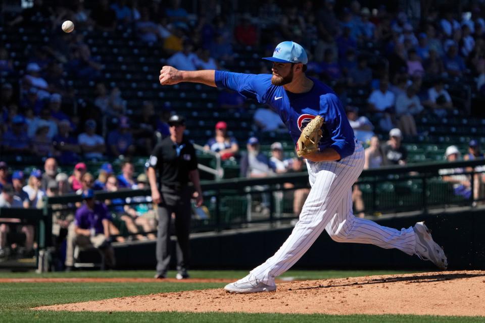 Cubs pitcher Chris Clarke throws a pitch against the Colorado Rockies in the third inning of a spring training game at Sloan Park.