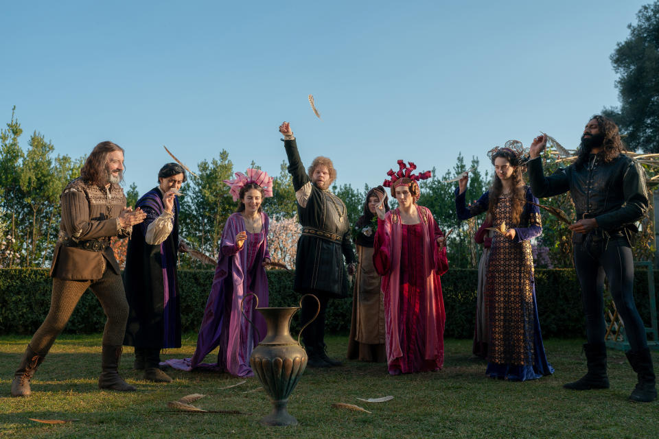 (L to R) Tony Hale as Sirisco, Karan Gill as Panfilo, Lou Gala as Neifile, Douggie McMeekin as Tindaro, Saoirse-Monica Jackson as Misia, Zosia Mamet as Pampinea, Tanya Reynolds as Licisca, and Amar Chadha-Patel as Dioneo in Episode 103 of The Decameron (Giulia Parmigiani/Netflix)
