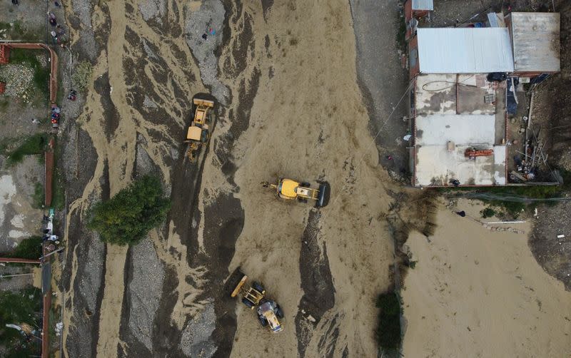 River flooding due to rain affects homes, in La Paz