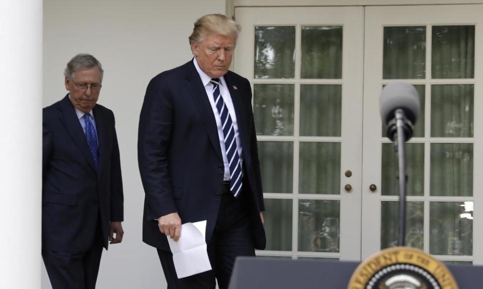 Donald Trump arrives to speak with the Senate majority leader, Mitch McConnell, in the Rose Garden at the White House on Monday.