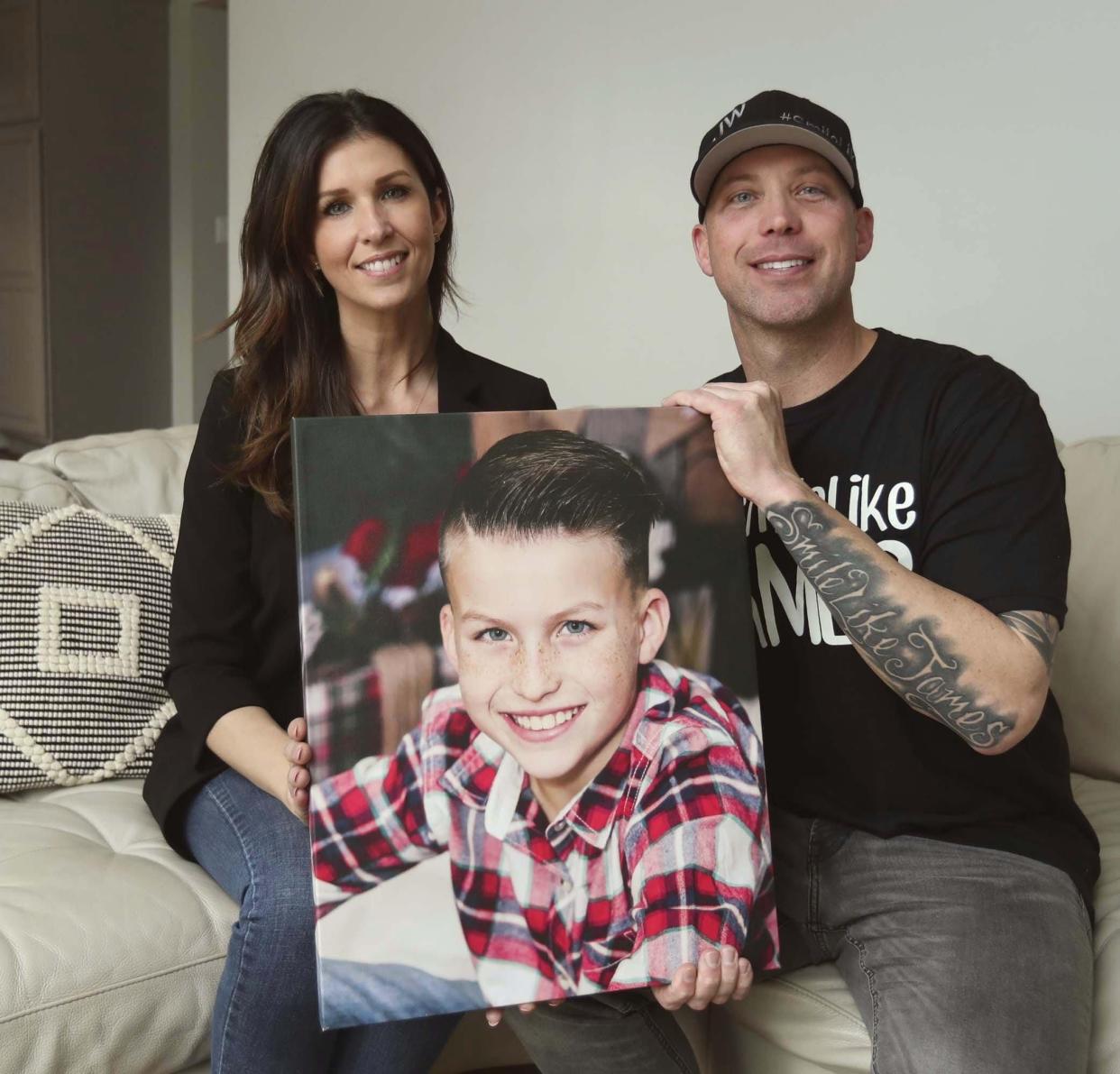 Joanna Ward and Ryan Ward hold a photograph of their son James, 10, in Jackson Township. James went to sleep March 11, 2019 and did not wake up the next morning. His unexplained death is called Unexplained Death in Childhood similar to Sudden Infant Death Syndrome (SIDS) in infants. Ryan wrote a song for his son who left a positive impression on many people's lives. There is also a Facebook page called "Smile Like James."