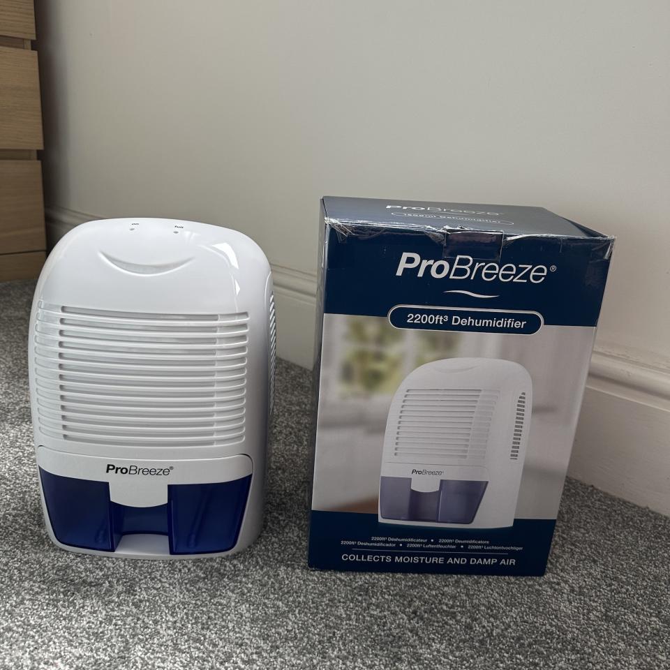 The ProBreeze 1500ml Mini Dehumidifier unboxed on a grey carpet