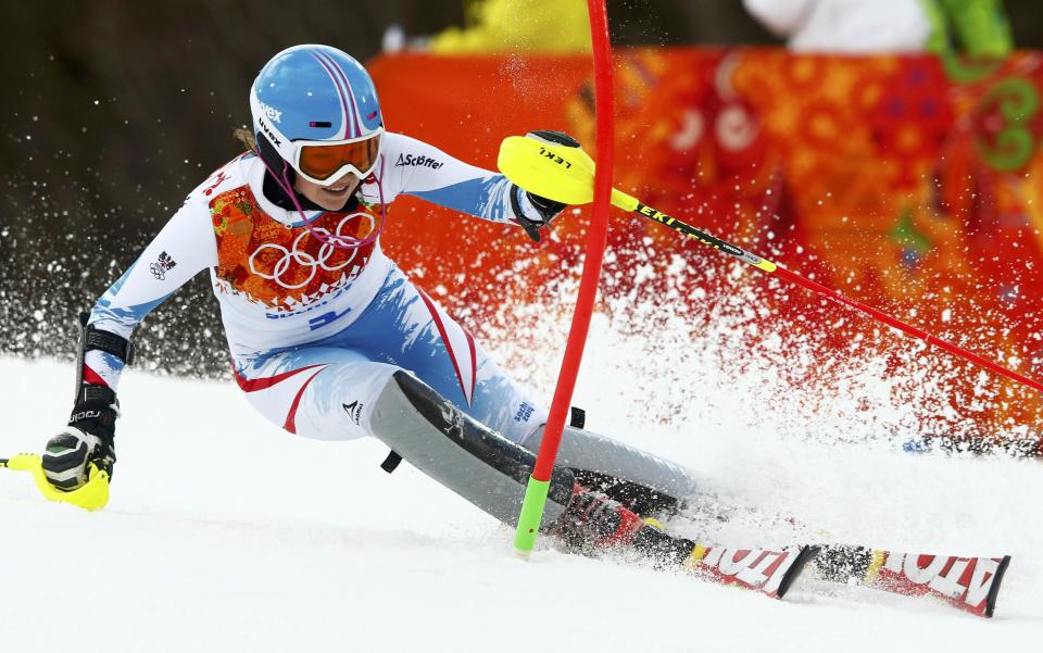 Austria's Schild clears a gate during the first run of the women's alpine skiing slalom event at the 2014 Sochi Winter Olympics