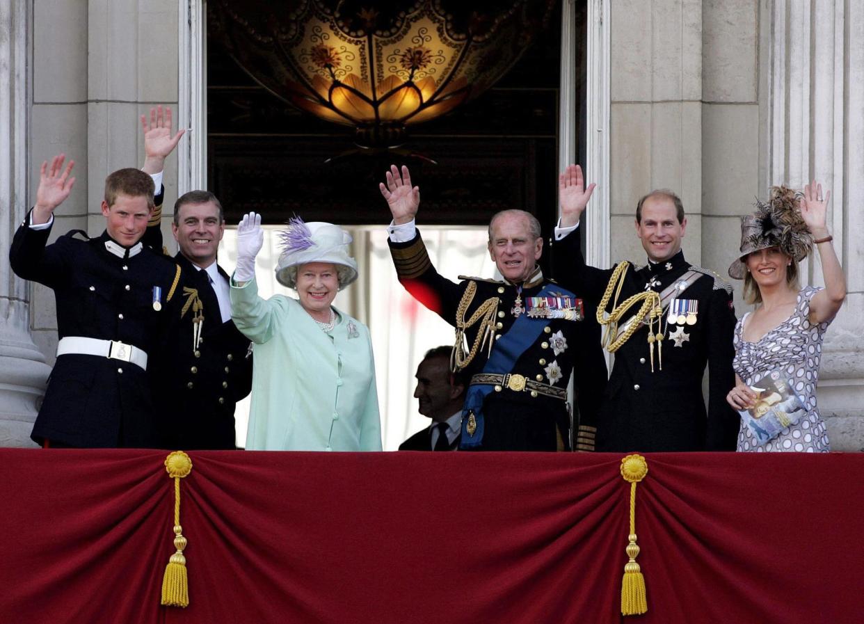 From left, Britain's Prince Harry, Prince Andrew, Queen Elizabeth II, Prince Philip, Prince Andrew and Sophie, Countess of Wessex, wave from the balcony of Buckingham Palace, in London, Sunday July 10, 2005, as part of a day of events marking the end of the Second World War. 