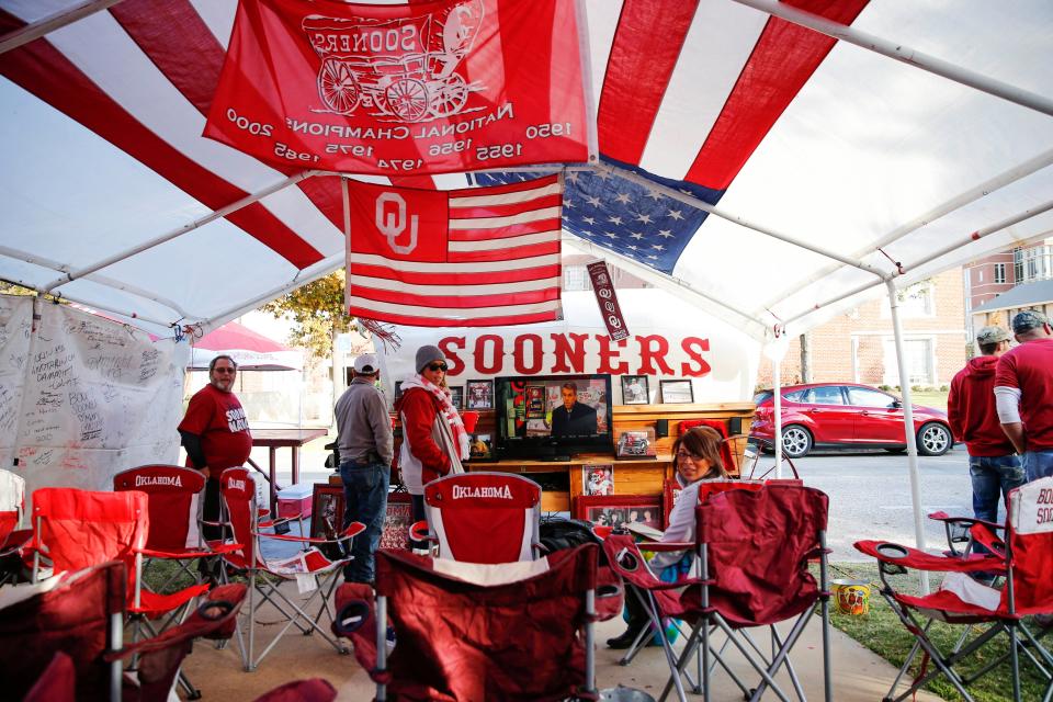 Nov 8, 2014; Norman, OK, USA; Oklahoma Sooners fan Roger Ashby (far left) tailgates in his tent before the game against the Baylor Bears at Gaylord Family - Oklahoma Memorial Stadium. Mandatory Credit: Kevin Jairaj-USA TODAY Sports