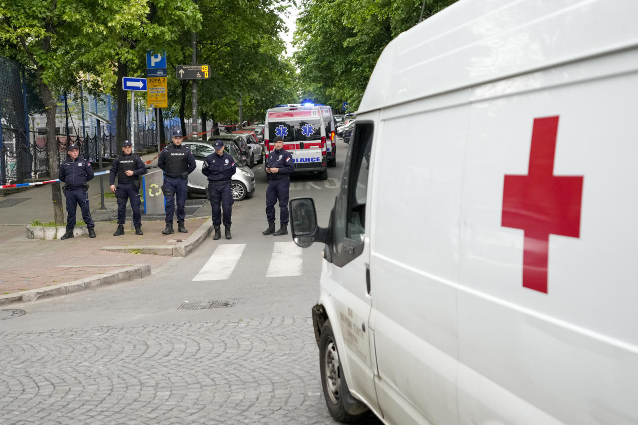 Police blocks street around the Vladislav Ribnikar school in Belgrade, Serbia, Wednesday, May 3, 2023. A teenage boy opened fire early Wednesday in a school in central Belgrade, causing injuries. (AP Photo/Darko Vojinovic)