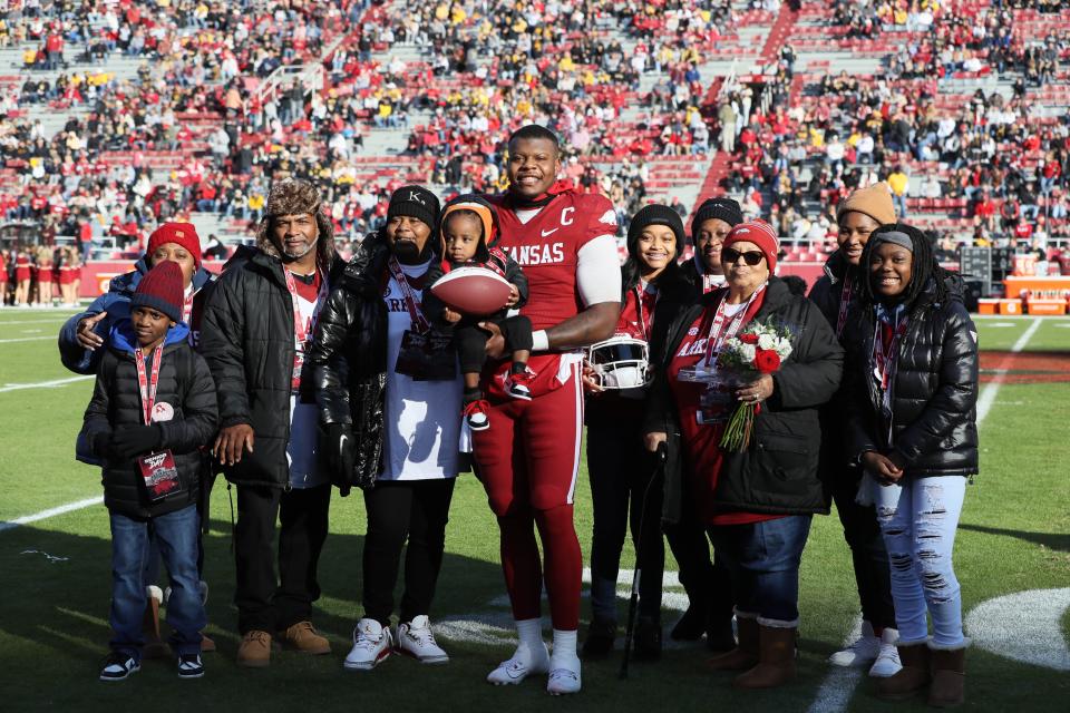 Nov 24, 2023; Fayetteville, Arkansas, USA; Arkansas Razorbacks quarterback KJ Jefferson (1) poses with family during senior presentations prior to the game against the Missouri Tigers at Donald W. Reynolds Razorback Stadium.