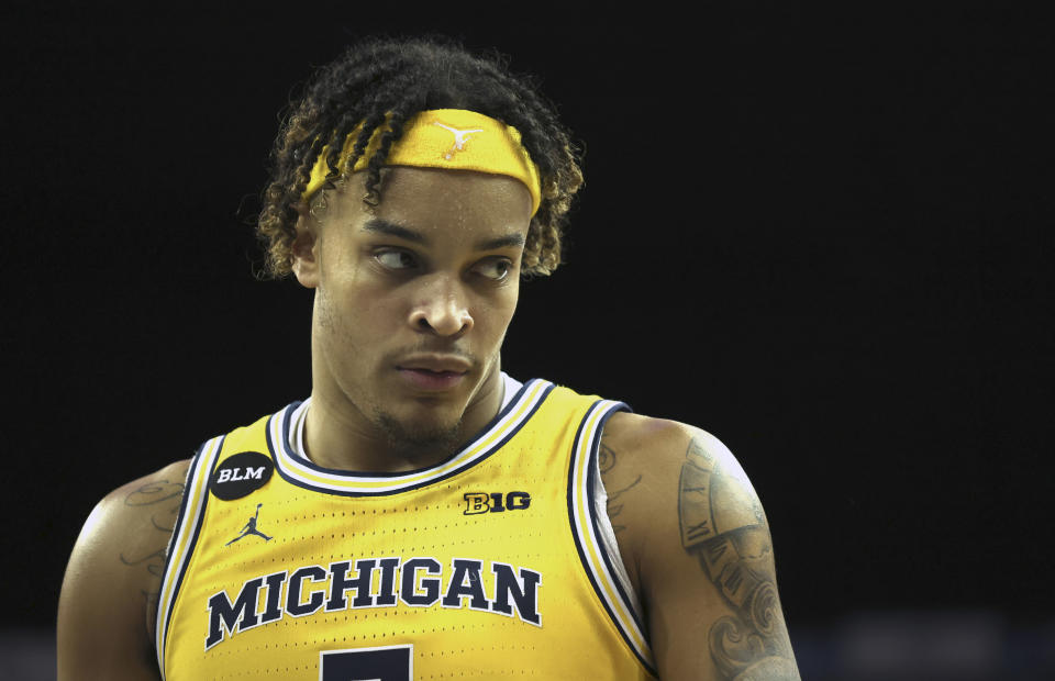 FILE - Michigan's Terrance Williams II reacts during an NCAA basketball game between Michigan Wolverines and Kentucky Wildcats at the O2 Arena, in London, Sunday, Dec.4, 2022. The toxic cauldron on social media is one of the minefields players in the NCAA Tournament must navigate. (AP Photo/Ian Walton, File)