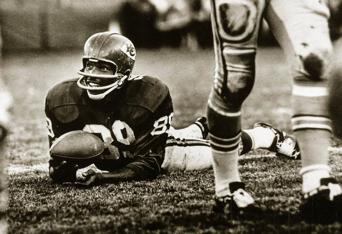 Kansas City Chiefs wide receiver Otis Taylor smiles after making a catch during a muddy game. Today, Taylor, 79, is bedridden in the care of his close family.